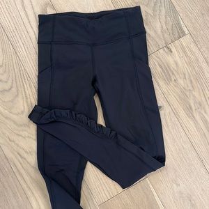 Black lululemon leggings with ruffle detail